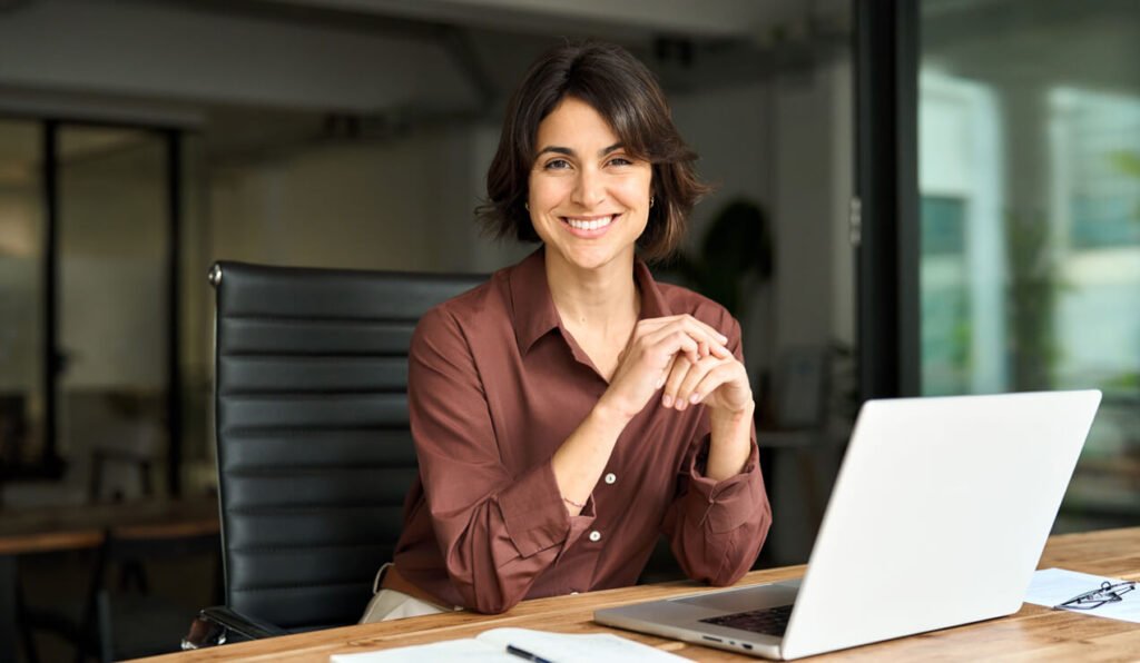 A business owner working at a laptop